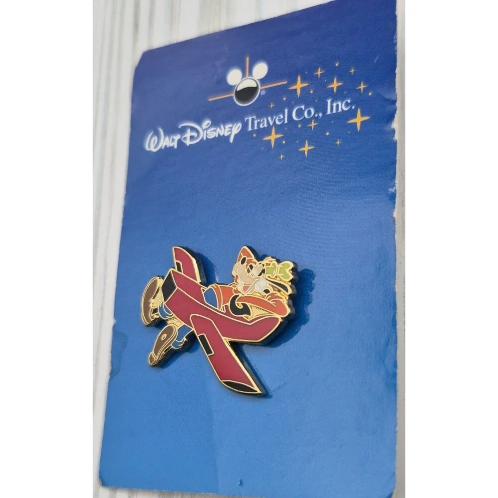 Vintage Walt Disney Travel Company Promotional Pin Goofy in a Red Airplane 2004
